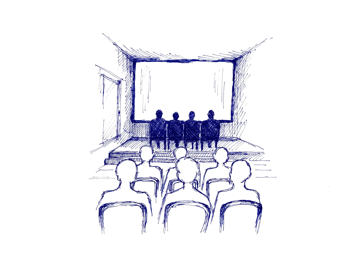 A small lecture hall seen from the back row, three short rows of seated listeners seen from behind and drawn in light outline, facing a low stage where four speakers sit in silhouette before a large blank screen, lightly drawn with much white paper showing, the whole scene drawn with wide empty margins on every side.