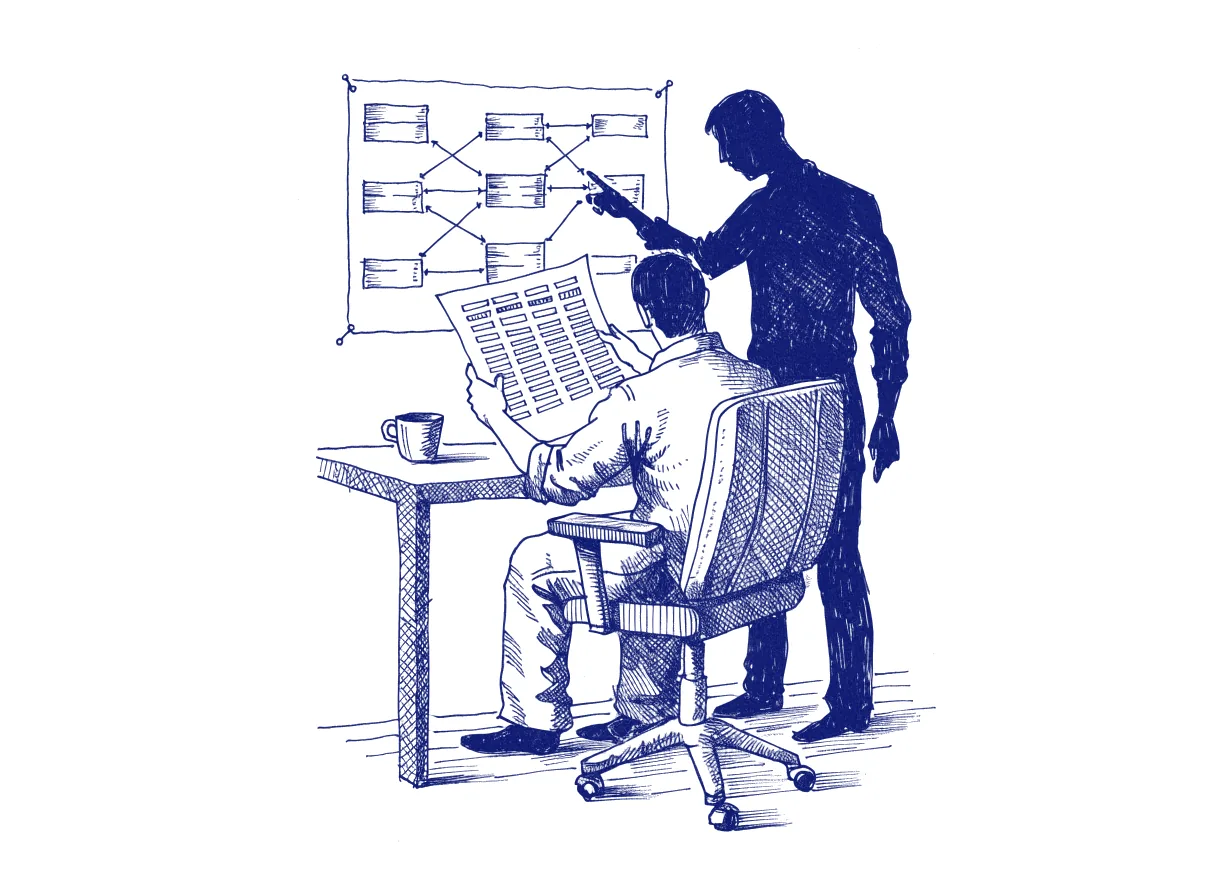 An engineer seen from behind at a desk compares a printed list of table columns with an old database diagram pinned to the wall, while a colleague in silhouette points at one line, the whole scene drawn with wide empty margins on every side.