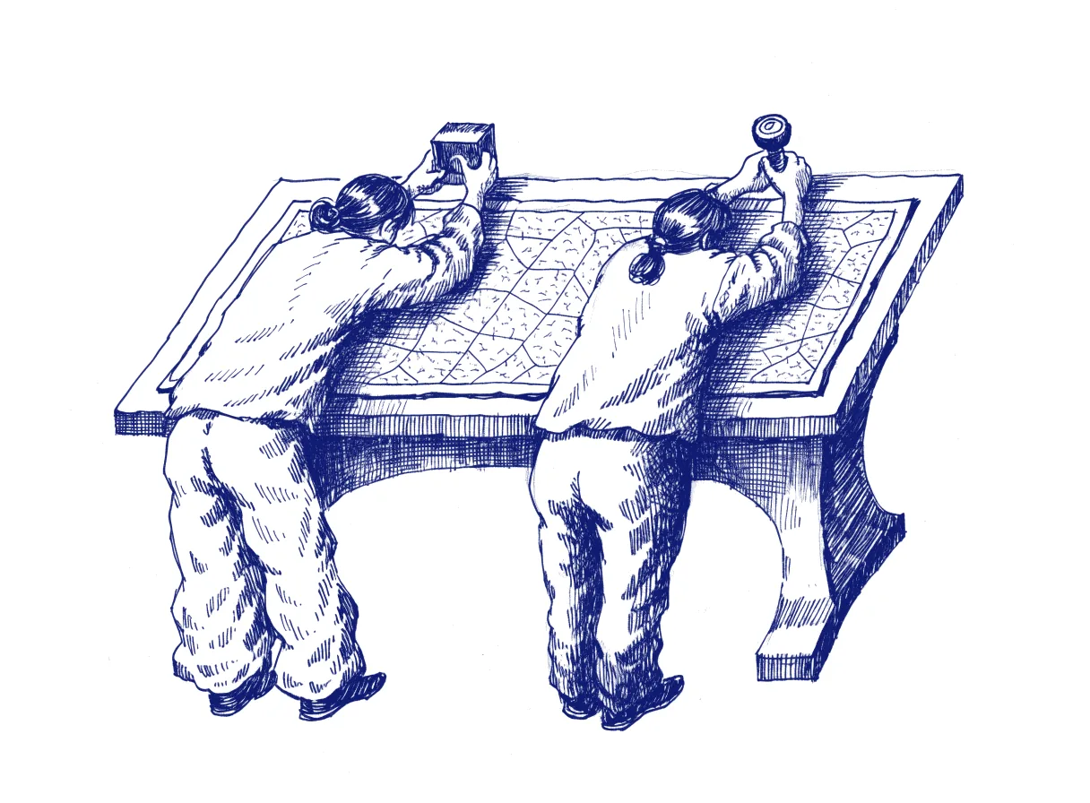 Two figures seen from behind lean over one wide drafting table and a single large map, each holding a different rubber stamp above their own corner of it, the whole scene drawn with wide empty margins on every side.