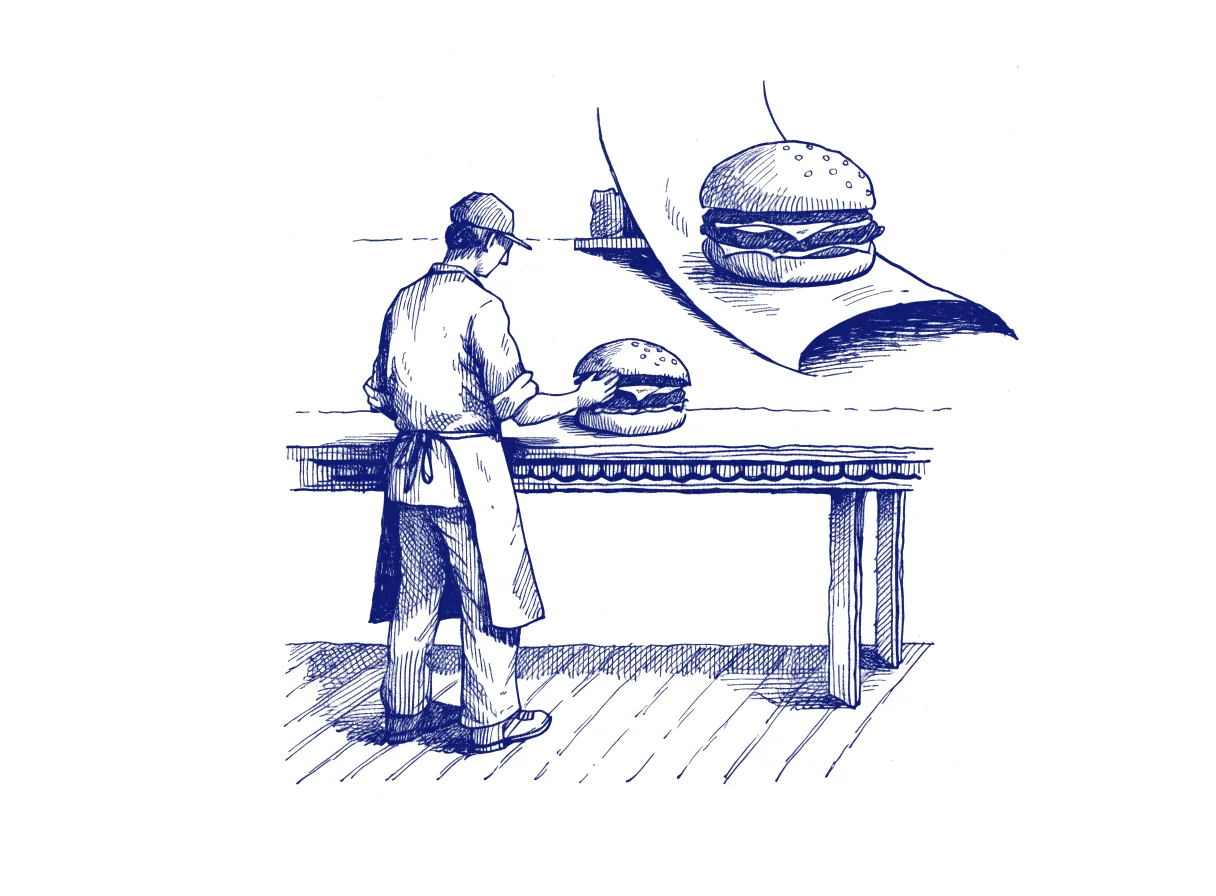 A cook seen from behind sets a real, slightly leaning burger on the serving counter, while a glossy menu photograph of a perfect burger curls loose from the wall behind, the whole scene drawn with wide empty margins on every side.